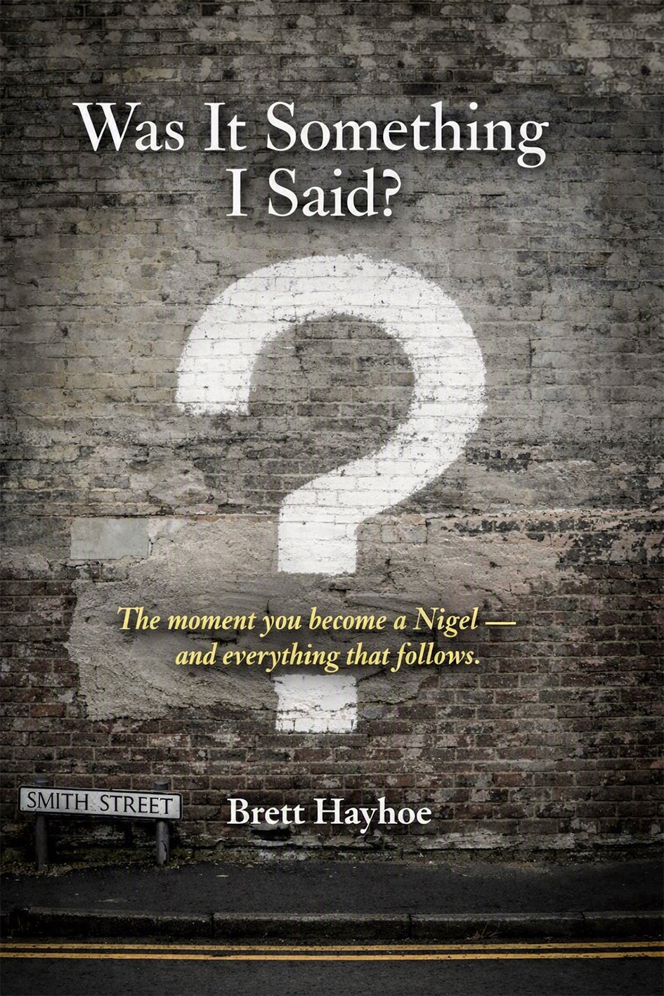 Book cover for 'Was It Something I Said?' showing a large white question mark on a weathered brick wall, author Brett Hayhoe remains visible at the bottom edge.